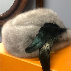 fur hat with feather